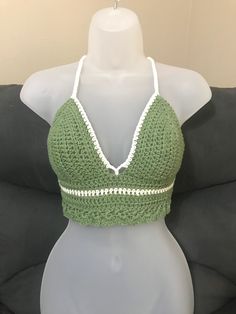 **Top will automatically come with white color trim unless you specifically pick a different color for it** -Hand crocheted crop top perfect for the warm summer months at the beach, or at any festival.  -Made with I Love This Cotton Yarn -The size of this top works best for someone who is 'Medium C cup' -Adjustable corset style tie in the back and a tie around the neck  -Hand wash with cold water and white vinegar to help set the color in place. Color will fade over time.  *Top will slightly shrink after the first wash* Green Crop Top For Vacation, White Cotton Triangle Top Crop Top, Fitted Crochet Trim Crop Top For Summer, Summer Fitted Crop Top With Crochet Trim, White Crochet Lace Summer Crop Top, Green Cropped Crochet Top For Summer, Green Triangle Crop Top For Summer, White Crochet Crop Top For Beach, Summer Green Triangle Crop Top