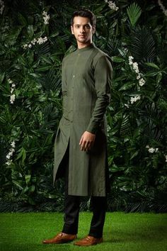 Moss green straight silhouette kurta with pintuck details, front slit and flap collar.
Component: 1
Neckline: Mandarin
Sleeve Length: Full
Fabric: Cotton Silk
Color: Green
Flap mandarin collar
Front button down
Pintuck details
Note: The pant worn by the model is not for sale - Aza Fashions Silk Kurta For Men, Kurta For Men, Party Reception, Kurta Men, Silk Kurta, Nehru Jackets, Groom Wear, Fashion App, Kids Sleepwear