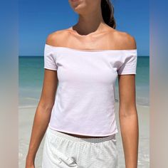 Cotton Blend Off The Shoulder Short Sleeve Crop Top With Raw Hem. Fabrics: 96% Cotton, 4% Elastane Measurement: 21"(53 Cm) Length, 16"(41 Cm) Bust Made In: Italy Casual Fitted Off-shoulder Crop Top, Fitted Basic Summer Tops, Fitted Crew Neck Top For Beach, Fitted Crew Neck Crop Top For Vacation, Basic Pink Top For Summer, Basic Pink Tops For Summer, Basic Pink Summer Top, Fitted Casual Vacation Tops, Casual Fitted Tops For Beach