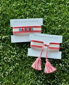 One size fits all,  white cotton/poly bracelet with red trim.   RAIDERS is embroidered in red and baby blue and was made for Archbishop Rummel High School.   Bracelet self ties. Adjustable White Friendship Bracelets For Game Day, White Embroidered Bracelets For Friendship, White Embroidered Bracelet As Gift, Tassel Bracelet, School Team, Braided Bracelets, All White, Custom Creations, One Size Fits All