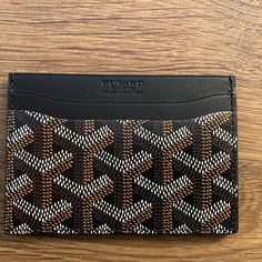 New Goyard Saintsulpice Cardholder- Classic Black Canvas/Leather Compact Wallet Brand New W/Tags - Goyard Saint-Sulpice Card Wallet - In Beautiful And Most Coveted Classic Black Harder And Harder To Get These Days. Goyard Is Limiting Their Colors And Sales Of Items. Beautiful Goyard Card Holder In Brilliant House Color Black. A Traditional Color And A Timeless Classic Piece. Goyardine Canvas And Calfskin Leather. This Is A Rare Beautiful Color! In Perfect/Mint Condition. Unworn, Unused. Negotiab Designer Wallets With Card Slots For Daily Use, Designer Card Holder With Interior Slots For Daily Use, Designer Business Wallets With Interior Card Slots, Designer Card Holder For Daily Use, Designer Leather Wallet With Card Slots, Designer Brown Card Holder For Daily Use, Designer Wallets With Card Slots For Formal Occasions, Designer Bifold Card Holder For Daily Use, Designer Black Card Holder With Rfid Blocking