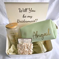 the bridesmaid gift box is filled with personalized items for her special day