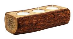 three tealight candles in a wooden holder