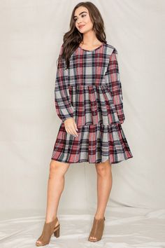 Made in the USA 95% Polyester 5% Spandex Elastic waistband, long sleeves with elastic, tiered skirt Size: 1X(18), 2X(20), 3X(22) 1X: Bust 44" Length 38" 2X: Bust 46" Length 38.5" 3X: Bust 48" Length 39" Fall Tiered Dress With Ruffle Hem, Casual Tiered Dress For Fall, Red Tiered Dress With Ruffle Hem, Long Sleeve Plaid Dress With Ruffle Hem, Red Long Sleeve Dress With Ruffle Hem, Casual Red Long Sleeve Dress, Red Tiered Dress For Fall, Fall Long Sleeve Dresses With Ruffle Hem, Long Sleeve Ruffle Hem Fall Dresses