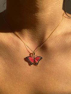 "Give her the gift of wings with this beautiful butterfly necklace. DETAILS - 14k gold butterfly with enamel - Both pendant and chain are 14k gold - Chain style may vary slightly - Approximately 1 3/16\" wide x 1\" tall VARIATIONS If you require any variation of this style, feel free to message us. We will do our best to accommodate you. Additional costs may apply depending on the variation. POLICY We do accept returns on this item minus a $25 restocking fee. Return shipping is the responsibility of the buyer. Any expedited shipping will not be refunded. If you have any questions, concerns, or are unsatisfied in any way with your order, feel free to message us and we will do our best to work with you." Pink Butterfly Charm Pendant Jewelry, Gold Enamel Jewelry With Butterfly Charm, Yellow Gold Butterfly Necklace With Adjustable Chain, Yellow Gold Butterfly Charm Necklace, Gold Butterfly Print Jewelry For Gift, Gold Jewelry With Butterfly Print For Gift, Yellow Gold Butterfly Pendant Necklace, Red Butterfly Jewelry For Gift, Red Butterfly-shaped Jewelry Gift