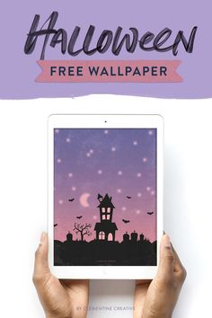 someone is holding up an ipad with the text halloween free wallpaper on it in front of them