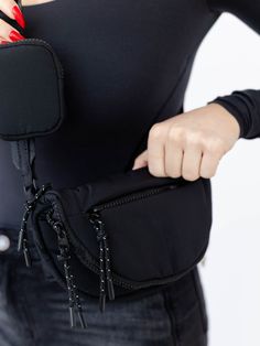 Athleisure inspired, we love this crossbody belt bag for any girl on the go! A unique zip and folder over flap small handbag features a zip around closure to keep all of your necessities safe and sound. A coinc purse accent sits on the adjustable strap for added storage. Measures approx. 8" x 5" Functional Shoulder Bag With Zipper Pocket For On-the-go, Functional Camera Bag With Zipper Pocket For On-the-go, Nylon Crossbody Shoulder Bag With Zipper, Multifunctional Crossbody Belt Bag For On-the-go, Functional Belt Bag Pouch For On-the-go, Functional Pouch Belt Bag For On-the-go, Functional Camera Bag With Zipper Pocket, Modern Bags With Zipper Closure For Outdoor Activities, Functional Crossbody Shoulder Bag With Cell Phone Pocket