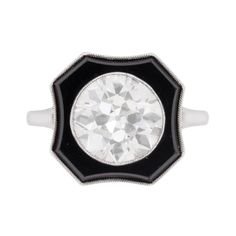 This stunning and elegant solitaire ring, features a beautifully hand cut old cut diamond. Weighing 3.30 carat, it is a J in colour and VS1 in clarity. It is perfectly rub over set and surrounded by a halo of onyx. The semi-precious gemstone is a deep black and highlights the shine of the diamond beautifully. The onyx is also rub over set within a platinum mount. The shank is also made of platinum. The ring is finished with mille-grain edging which will have been hand crafted. Gemstone: Diamond Stone Shape: Old Cut Carat Weight: 3.30 Colour: J Clarity: VS1 Metal: Platinum Age: 1920s Size: O Jewelry Knowledge, Contemporary Engagement Rings, Art Deco Diamond Rings, Vintage Jewelry Art, Onyx Jewelry, Art Deco Engagement, Antique Engagement, Deco Engagement Ring, Antique Engagement Rings