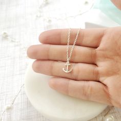 "Beautiful handmade anchor necklace in 925 sterling silver. This delicate necklace is perfect as a gift for a special woman, Christmas gift, beach wedding, bridesmaid, birthday or her special day. ♥ Details: Metal type: Sterling silver Karat / purity: 925 Anchor dimensions: 9.7 x 8.1mm Chain length: 14\", 16\", 18\", 20\". The necklace is 100% handmade. Each necklace takes approximately 2 hours to be ready, so you are buying a piece that was made with love and dedication. All jewelry comes with Adjustable Nautical Style Jewelry For Gifts, Nautical Style Adjustable Jewelry Gift, Nautical Sterling Silver Necklace For Gift, Nautical Sterling Silver Necklace Gift, Nautical Sterling Silver Necklace As Gift, Minimalist Sterling Silver Jewelry For Beach, Silver Nautical Jewelry With Adjustable Fit, Anchor Shaped Jewelry With Adjustable Chain For Gift, Adjustable Nautical Silver Jewelry