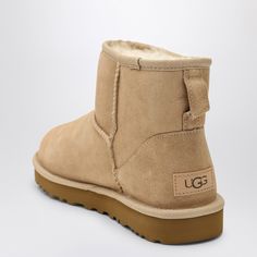 Sand-coloured suede ankle boot from UGG featuring sheepskin and suede upper, round toe, sheepskin insole and Treadlite sole by UGG. Boot height: 13.97 cm.100% Leather / Rubber sole Ugg Classic Mini Ii, Ugg Boot, Colored Boots, Ugg Classic Mini, Ugg Classic, Sand Color, Classic Mini, Suede Ankle Boots, Ugg Boots