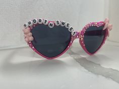 Cute heart shaped sunglasses inspired by Sabrina Carpenter! Great for going to a concert, party, Halloween, or even as party favors to fans of all ages! Add what you want your glasses to say in personalization. Many different types of charms available feel free to message me and we can figure out what you're looking for! 😊Glasses come with partial rhinestones and no charms up charge for more rhinestones and charms which are options listed below! if you want a certain color of rhinestones feel free to add that to personalization! All glasses automatically come with color coordinated rhinestones. Pink Sabrina Carpenter, Going To A Concert, Concert Party, Heart Glasses, Shaped Sunglasses, Heart Shaped Sunglasses, Cute Heart, Party Halloween, Pink Outfits