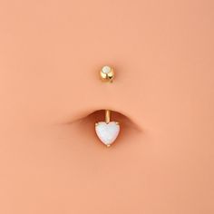 Save 15% Off with Code "GOLD15" Description: Heart Design: You won't miss this opal glitter yellow gold heart prong set belly button ring, which can satisfy you all unique dress-up!This trendy belly button piercing features a glitter heart shape white opal on the bottom and a small rounded opal gem on the top. It is Lightweight, comfortable, and easy to insert and screw the top ball. Safe Material: Made of 14KT real gold, good for sensitive skin, even can be used as the first piercing belly ring