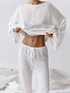 Elevate your relaxation game with our Round Neckline Long Sleeve Pajama Set. This sleek and breathable ensemble in classic white features long sleeves and long pants, perfect for leisurely evenings at home. Its understated elegance and semi-sheer fabric add a touch of allure to your loungewear collection.Key Features:Comfortable Design: Crafted for comfort, this pajama set boasts a round neckline and long sleeves, providing a cozy fit for lounging.Stylish Simplicity: The minimalist design exudes Pijamas Women, Dirndl Outfit, Barbie Mode, Women Sleepwear, Bandeau Tops, Mini Robes, Loose Fitting Tops, Sleepwear Sets, Pyjama Set