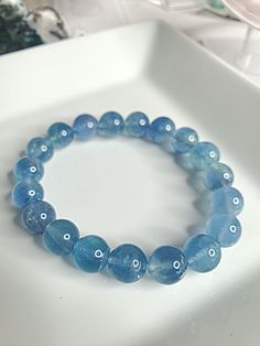 "If you have any other Welcome to my \"MajesticCrystalVibez\" Shop You are viewing\"10mm Blue Flourite Crystal Bead Bracelet | Crystal Healing Bracelet | Good Vibes | Gemstone Bracelet | Natural Fluorite Jewelry | Love Trust\" etsy listing. Introducing our stunning Blue Flourite Bracelet, featuring enchanting 10mm beads. Handcrafted with love and care, this bracelet is a true work of art. The mesmerizing shades of blue in the Flourite crystals will captivate all who lay eyes on it.  Whether you' Cheap Blue Beaded Bracelets, Cheap Handmade Blue Beaded Bracelets, Cheap Blue Beaded Chain Bracelets, Cheap Light Blue Beaded Bracelets, Blue Bracelet Crystal, Blue Crystal Bracelet With Natural Stones, Blue Round Crystal Bracelet For Spiritual Wear, Blue Gemstone Crystal Bracelet For Healing, Blue Crystal Bracelet Gift