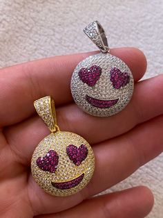 "Super cute custom made Smiley Face Heart Eyes emoji pendant! Great for men or ladies SUPER ICY! Solid 925 sterling silver...never turns green Stamped 925 We have 2 styles! Natural silver finished & 14k yellow gold finished! Measures roughly 1\" by 1\" (1.25\" w. bale) ...weighs roughly 11 grams 200 micropaved handset simulated diamonds (CZ) CHAIN IS NOT INCLUDED Fits up to 6mm chains" White Novelty Jewelry For Valentine's Day, Novelty White Jewelry For Valentine's Day, Valentine's Day White Novelty Jewelry, Novelty Smiley Face Jewelry As Gift, Novelty Smiley Face Jewelry For Gifting, Novelty Smiley Face Jewelry For Gifts, Novelty Smiley Face Jewelry Gift, Heart Eyes Emoji, Ice Necklace