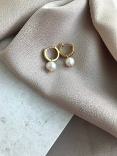 Gold Hoop Pearl Earrings, Small Chunky Hoop Pearl Earrings, Everyday Jewelry, Christmas Gift, Mom's Gift, Special Day Gifts, Gift for Her Stylish Touches ! You will feel great with these modern classic earrings that reflect your elegance. Whether you use it daily or crown your evening dress elegance. When you combine it with a few layered mini earrings, you should order these earrings that will look even more stylish. If you wish, gift it to your friends as bridesmaid jewelery. It is beneficial White Huggie Earrings As Gift, White Drop Huggie Earrings, Small Hoop Pearl Earrings For Gift, Small Hoop Pearl Earrings As Gift For Pierced Ears, White Small Hoop Huggie Earrings As A Gift, Hoop Pearl Earrings Gift, Hoop Pearl Earrings For Gifts, Hoop Pearl Earrings With Ear Wire For Gift, Hoop Pearl Earrings With Ear Wire As Gift