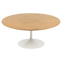 an oval wooden table with white base