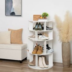 there is a white shelf with shoes on it