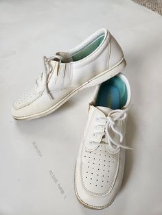 Good vintage condition, slight yellowing from age. White Size 10 ladies Insole 10.25" Ball of foot 3.5" across low heel Classic White Walking Shoes With Round Toe, Classic White Round Toe Walking Shoes, Classic White Walking Shoes With Ortholite Insole, White Closed Toe Walking Shoes, Vintage Low-top Lace-up Shoes With Rubber Sole, Vintage Nurse Shoes, Vintage Canvas Shoes With Rubber Sole And Lace-up, Vintage Canvas Lace-up Shoes With Rubber Sole, Vintage Semi-formal Dress Shoes With Rubber Sole