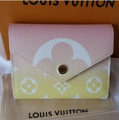 Brand New Louis Vuitton By Pool Edition Wallet Victorine Brume NEW AUTHENTIC. Condition is New with dust bag, box, tag. This special edition  LV by Pool collection. Crafted from Monogram canvas. Though extremely compact, this envelope-style wallet still has ample space for cash and cards. 4.72 x 3.74 x 0.59 inches  (Length x Height x Width)  Brume Peach Monogram coated canvas Cowhide-leather lining Silver-color hardware Press-stud closure Zipped coin pocket Bill pocket 2 flat pockets 6 card slot Pink Rectangular Wallet With Original Box, Gold Wallets With Original Box For Gift, Luxury Multicolor Wallet For Daily Use, Designer Multicolor Wallets With Card Slots, Luxury Multicolor Wallets With Card Slots, Designer Pink Wallet With Card Slots, Pink Wallets For Daily Use With Dust Bag, Luxury Multicolor Wallets For Travel, Designer Multicolor Travel Wallet