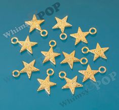 These star shaped charms are double-sided and are about 21mm in diameter. They work great for adding to a charm bracelet, necklace, earrings, or even a key chain. You can see some similar gold toned metal charms by clicking here. • SIZE: 21mm x 15mm • SHAPE: Star • FINISH: Gold • MATERIAL: Alloy Metal • STYLE: Metal Metal Charms, Twinkle Star, Jewellery Making Materials, Jewelry Making Charms, Pearl Flower, Gold Star, Metal Charm, Metal Style, Star Charms