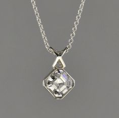 "18 kt white gold pendant. Set with 1.05 carat Asscher cut F-VS2 diamond. The Diamond can be upgraded in size or quality or lesser size and quality. The pendant comes with an 18 kt 1.1 mm 16\" cable chain.  The Diamond is certified." Elegant Silver Asscher Cut Solitaire Necklace, White Asscher Cut Jewelry With Bezel Setting, Asscher Cut Solitaire Necklace With Diamond Accents, Silver Jewelry With Asscher Cut And Bezel Setting, Silver Jewelry With Asscher Cut Bezel Setting, Silver Jewelry With Bezel Setting And Asscher Cut, Silver Asscher Cut Jewelry With Bezel Setting, Tiny Diamond Necklace, Delicate Diamond Necklace