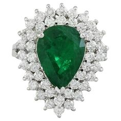 5.80 Carat Natural Emerald 14 Karat Solid White Gold Diamond Ring Stamped: 14K Total Ring Weight: 6.3 Grams Emerald Weight 4.30 Carat (13.00x9.00 Millimeters) Diamond Weight: 1.50 carat (F-G Color, VS2-SI1 Clarity ) Quantity: 34 Face Measures: 22.85x18.65 Millimeter SKU: [600530]