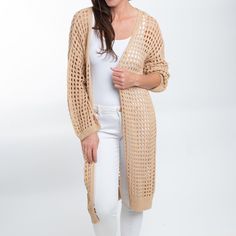 Beat the chill in style with the Enya Long Crochet Cardigan. Featuring a trendy neutral sepia tone with an open crochet detail, this cardigan is easy to wear and certain to become your spring go-to. This long sleeve sweater is perfect for your Spring and Summer wardrobe, throw over your favorite top with a pair of leggings or skinny jeans with some sandals and necklace for a classic look! This top is a light weight sweater, it will give you enough warmth and comfort in a cool day without looking Knit Open Front Outerwear For Beach, Open Front Knit Outerwear For Beach, Open Front Knit Outerwear For The Beach, Lightweight Cardigan For Beach In Fall, Cozy Beach Cardigan, Spring Open Knit Cardigan, Chic Open Knit Cardigan For Layering, Beach Open Knit Outerwear, Trendy Open Knit Open Front Cardigan