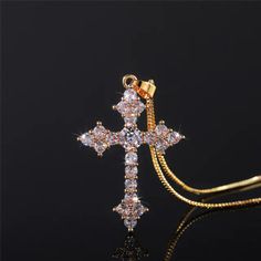 This stunning Brass and Zirconia Christian Cross Necklace for Women makes a perfect addition to a believer's wardrobe. Made with brass and cubic zirconia, it shines brightly and will add elegance to whatever you choose to wear. Among believers who know at least a thing or two about our Lord and Savior, Jesus Christ, this is a great accessory to compliment any outfit.Choose which color of the cross you prefer. Perhaps go for all four options to complete the collection. Additional Product Specific Luxury Ornate Cross Pendant Necklace, Luxury Silver Chain Cross Pendant, Luxury Crucifix Jewelry With Diamond Accents, Luxury Spiritual Cross Pendant Jewelry, Luxury Elegant Cross Necklace, Christian Cross Necklace, Jewelry Accessories Ideas, Neck Jewellery, Jewelry Lookbook