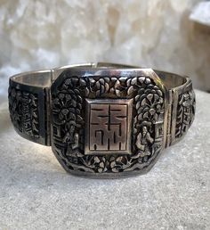 Circa 1920s Beautiful Old Chinese Shou Village Scene Tempel Sterling Silver Vintage Antique Braclet Face measures over 1 1/2 wide by 1 1/2 inches tall Antique Engraved Wide Band Jewelry, Antique Wide Band Engraved Jewelry, Vintage Engraved Wide Band Jewelry, Vintage Wide Band Engraved Jewelry, Vintage Wide Band Jewelry With Intricate Design, Antique Rectangular Carved Jewelry, Antique Rectangular Ceremonial Jewelry, Vintage Engraved Bracelets For Ceremonial Occasions, Vintage Rectangular Bracelet Strap Jewelry