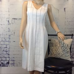 Dina Agam White Waffle Weave Linen Blend Sundress. Sleeveless, Fit And Flare, With V-Neck And Black Contrast Stitching. Fully Lined With Back Zipper. Beautiful And New With Tags! Size Xs Measurements- 32" Bust, 26" Waist, 34" Hips, 39" Length Shell: 55% Linen 45% Cotton Lining: 100% Cotton Thanks For Stopping By! Be Sure To Check Out Our Other Specially Curated, Fabulous Fashions! And..Feel Free To Make A Reasonable Offer! Elegant White Sleeveless Dress For Vacation, Fitted Sleeveless Linen Dress Elegant, Elegant Fitted Linen Sleeveless Dress, White Fitted Linen Sleeveless Dress, White Stretch V-neck Sleeveless Dress, White Sleeveless V-neck Stretch Dress, Elegant Sleeveless Linen V-neck Dress, White Sleeveless Sheath Dress For Summer, White Sheath Sleeveless Dress For Summer