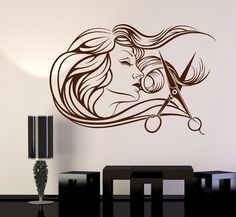 a wall decal with scissors and a woman's face