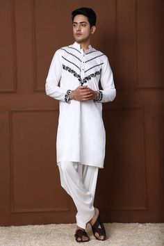 White kurta with thread embroidered floral jaal and geometric patterns. Comes with a pathani. - Aza Fashions White Salwar Kameez With Naqshi For Festivals, Cotton Salwar Kameez With Naqshi For Festivals, Festival Cotton Salwar Kameez With Naqshi, Traditional Naqshi Salwar Kameez For Navratri, Festival Mulmul Kurta With Naqshi Detail, Mulmul Kurta With Naqshi For Festivals, Cotton Traditional Wear With Naqshi For Eid, Bollywood Style Cotton Traditional Wear With Naqshi, Cotton Kurta With Intricate Embroidery For Festivals