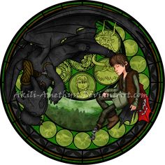 a stained glass window with a boy and a dragon