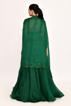 Emerald green cape with tonal floral embroidery. Comes with matching blouse and embroidered waistband lehenga. - Aza Fashions Green Sharara With Floral Embroidery, Green Floral Embroidered Sharara, Festive Green Sets With Cape Sleeves, Green Cape Sleeves Sets For Eid, Green Cape Sleeve Sets For Eid, Embroidered Fitted Anarkali Set With Cape Sleeves, Fitted Embroidered Anarkali Set With Cape Sleeves, Green Sets With Cape Sleeves For Reception, Green Dori Work Dresses