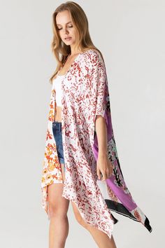 Boho print kimono with contrasting prints. Ultra light, draping open-front. Light and billowy silhouette, perfect for effortless layering. CARE | Hand Wash Cold or Dry Clean CONTENTS | 100% Viscose MEASUREMENTS | 36"/91 cm Top to Bottom (Size O/S) MODEL | 5'8 - wearing O/S IMPORTED Multicolor Printed Wrap Cover-up, White V-neck Kimono For Daywear, White V-neck Kimono For Day Out, Flowy Open Front Printed Cover-up, Open Front Layering Cover-up, Multicolor Print Kimono For Spring Beach Cover-up, White Printed Kimono For Spring, Flowy Kimono For Daywear, White Floral Print Wrap Kimono