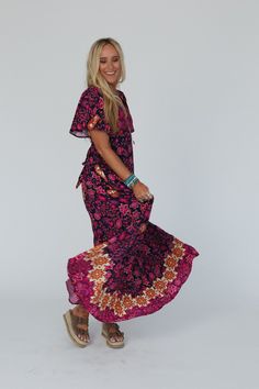 So stunning, you'll add a touch of boho style everywhere you go with our Midnight Floral Maxi Dress - it's a showstopper! Comfortable, lightweight, woven fabric with a bold contrast floral print throughout Relaxed maxi dress silhouette Flattering deep V neckline with short flutter sleeves Smocked back with adjustable self tie belt and side zipper for great fit Lining for added coverage Pair with: Eye Of The Sun Padded Bralette, Turquoise Cascade Necklace and Dazey Springs Buckle Sandal. *Due to Bohemian Multicolor Floral Print Maxi Dress, Hippie Boho Maxi Dress With Floral Print, Hippie Floral Print Maxi Dress, Spring Hippie Printed Maxi Dress, Hippie Printed Maxi Dress For Spring, Printed Floor-length Maxi Dress For Festivals, Floral Print Maxi Boho Dress For Festivals, Hippie Floral Print V-neck Maxi Dress, Spring Floor-length Hippie Boho Dress