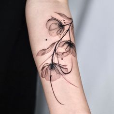 a black and white photo of a flower on the left arm, with watercolors