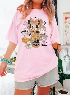 LightMyShirt Retro Minnie Halloween Shirt, Cute Halloween Shirt, Disney Woman Shirt, Disney Halloween Shirt, Minnie Pumpkin Shirt - 2024 Collection. Elevate your fashion game with our exquisite shirt. Meticulously crafted from premium materials, it seamlessly fuses style and comfort. Be it a formal occasion or a laid-back gathering, this versatile shirt is your ideal choice. Its timeless design exudes sophistication and effortlessly complements any ensemble. Step into the spotlight and redefine Minnie Pumpkin, Disney Halloween Shirt, Disney Halloween Shirts, Disney 2024, Halloween Disney, Woman Shirt, Halloween Cute, Disney Ladies, Pumpkin Shirt