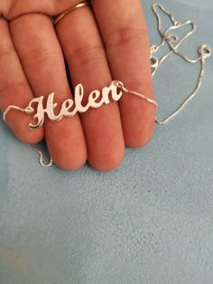 925 Sterling Silver Name Necklace - Personalized Pendant - Big Name Pendant - Cursive Font - Helen . . . . . . . . . . . . . . . . . . . . . . . . . . . . . . . . . . . . . . . . . . . . . . . . . . . . . . . . . . Looking for a thoughtful gift for your loved one? You will love this high quality925 Sterling Silver Name necklace. This is a perfect gift for your girlfriend or wife. Personalize it with her name in a beautiful font. This lovely 925 Sterling Silver name necklace is made to order. Cho Gold Sterling Silver Name Necklace With Polished Finish, Gold Polished Sterling Silver Name Necklace, Custom Sterling Silver Pendant Necklace, Custom Fine Jewelry Sterling Silver Pendant Necklace, Personalized Nameplate Jewelry With Polished Finish, Formal Sterling Silver Name Necklace, Personalized White Gold Fine Jewelry Necklace, Fine Jewelry Necklaces Stamped 925 As Gift, Formal Sterling Silver Round Name Necklace