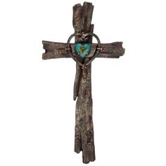 a cross with a blue heart on it is hanging from the side of a wall