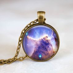 Handmade art pendant necklace featuring the mystical space galaxy "Heavenly Nebula". You can choose your finish between antique silver, antique bronze, gunmetal, antique copper.**********************************************************************This beautiful pendant is handcrafted by me... using a high quality art print image and is protected by a beautiful crystal clear domed glass cabochon which enhances the image for a truly stunning effect!The glass cabochon measures approximately 1 inch Fantasy Necklace, Galaxy Necklace, Celestial Necklace, Space Galaxy, Crescent Moon Necklace, Art Pendant, Moon Jewelry, Nature Jewelry, Moon Necklace