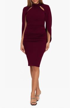 Go anywhere serving up serious confidence in this scuba sheath dress boasting a flirty cutout and cape-inspired overlay. 40" length (size 8) Mock neck Long sleeves Partially lined 94% polyester, 6% spandex Dry clean Made in the USA of imported fabric Draped Stretch Bodycon Dress For Cocktail, Stretch Draped Bodycon Dress For Cocktail, Party Sheath Midi Dress With Draped Sleeves, Cocktail Sheath Midi Dress With Draped Sleeves, Chic Sheath Bodycon Dinner Dress, Chic Fitted Mini Dress With Cape Sleeves, Fitted Midi Dress With Cape Sleeves For Cocktail, Fitted Midi Cocktail Dress With Cape Sleeves, Draped Fitted Bodycon Dress For Formal Occasions