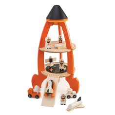 an orange and black toy rocket with lots of items