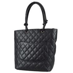 Chanel Cambon Ligne Tote Handbag Black Calfskin Engraved / Number 8865249 Pocket Outside: Pocket x1 Inside: Zipper Pocket x2, Pen Holder x2 Size(Inch) W 7.9 x H 9.4 x D 4.3 " Handle Drop. 6.3 " Size(cm) W 20.0 x H 24.0 x D 11.0 cm Handle Drop. 16.0 cm Color / Material Black, White / Calfskin Leather Accessory Serial Sticker, ity Card, Care Manual, Dust Bag, Boutique Sticker Country of Manufacture Italy SKU Number 28631 Damage Outside Good condition Scuff. Inside Good condition Other - Smell - Bag Boutique, Chanel Cambon, Leather Accessory, Hermes Shoes, Handbag Black, Louis Vuitton Shoes, Dior Shoes, Tote Handbag, Chanel Shoes