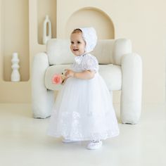 Embrace the sacred moment of your baby girl's baptism with our exquisite Christening Dress. This elegant gown is crafted with the utmost care, ensuring your little one looks angelic and radiant on this special day. Soft, luxurious fabrics drape gracefully, creating a timeless silhouette that will captivate all who witness your child's blessing Princess Style Fitted Baptism Dress For First Communion, White Tulle Princess Dress For Baptism, Princess Style Baptism Dress For First Communion, Princess Style Fitted Baptism Dress, Fitted Princess Style Baptism Dress, White Princess Baptism Dress, White Tulle Baptism Dress For Ceremony, Fitted Princess Gown For Baptism, White Princess Gown For First Communion