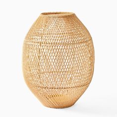 a large vase made out of bamboo on a white background