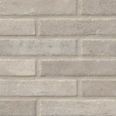 a white brick wall with no mortars or mortars on the bottom and sides