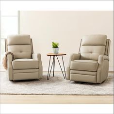 two recliners sitting next to each other on a rug