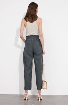 Tapered legs enhance the everyday sophistication of lightweight cotton pants complete with a matching tie belt. Zip fly with button closure Front scoop pockets; back patch pockets Removable tie belt 100% cotton Dry clean Imported Wide Leg Ankle Pants, Summer Style Guide, Jumpsuit And Blazer, Led Fashion, Swimsuit Fashion, Fashion Story, High Waisted Trousers, Ankle Pants, Cotton Pants